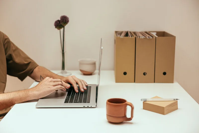 Laptop on a desk representing organized digital file management