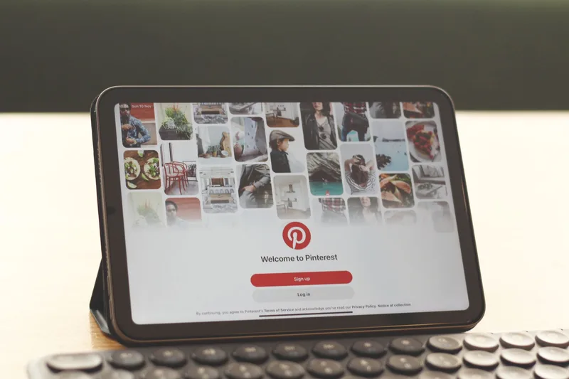 Pinterest board showing four digital product pins linked to Etsy store listings with pin format mockups