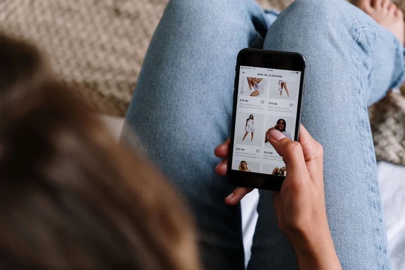 A phone screen showing an Etsy art listing with mockup photos