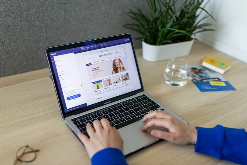 Laptop on a desk showing an Etsy shop setup screen